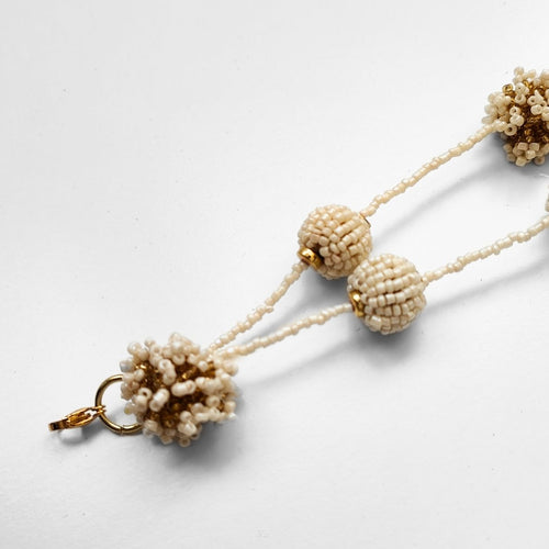 COLLAR POMPÓN BEIGE GRANDE