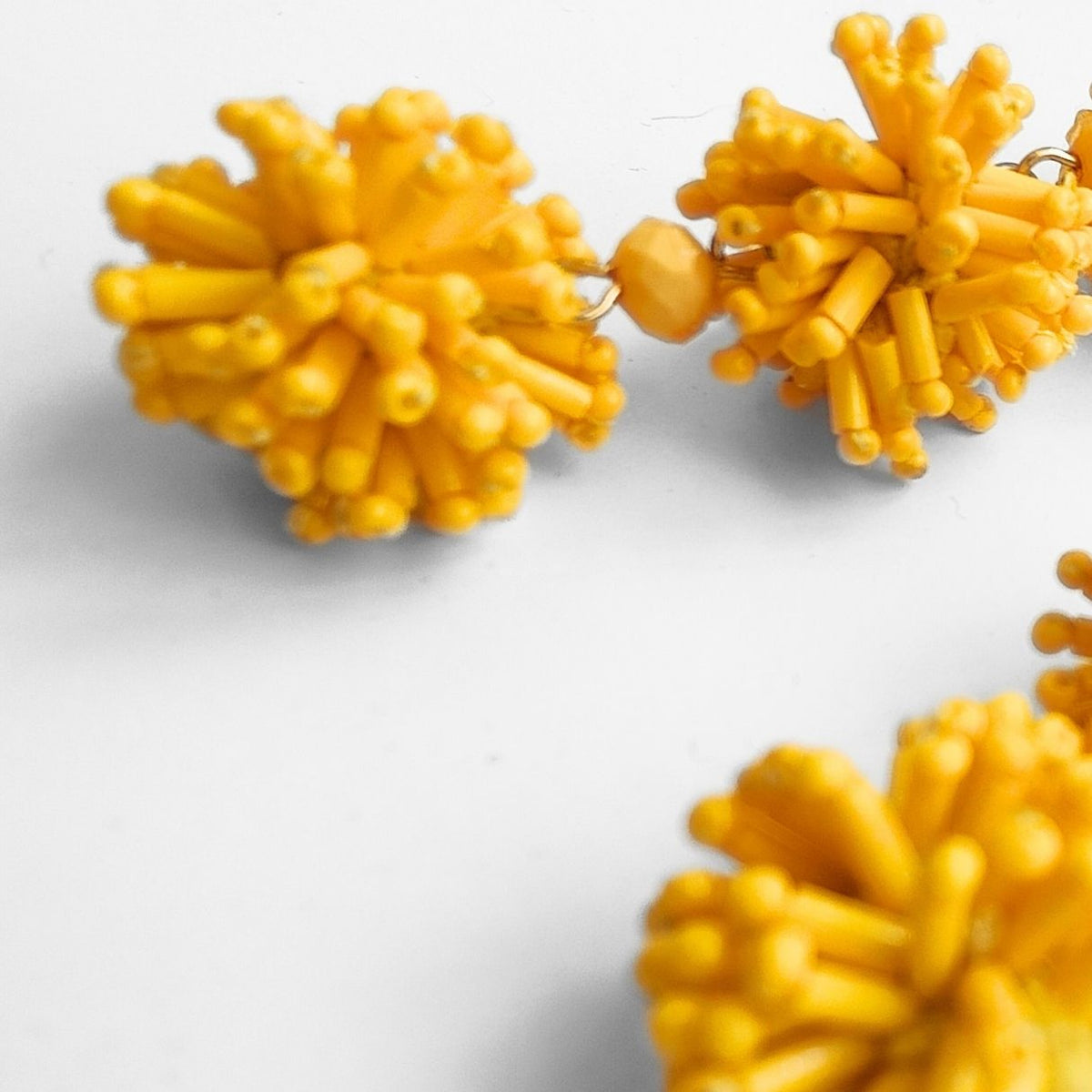 YELLOW POMPON EARRINGS