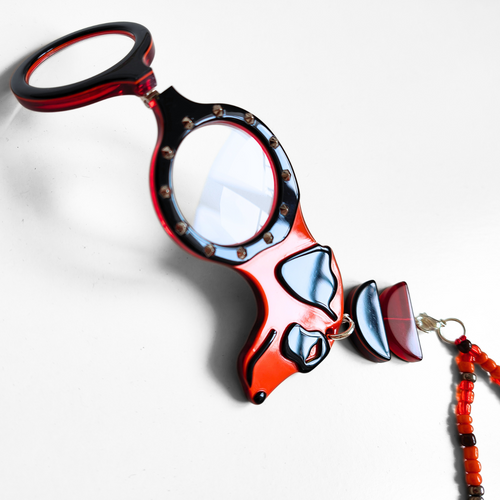 COLGANTE-GAFAS PERRO PUNK NARANJA - EDICIÓN 15 AÑOS